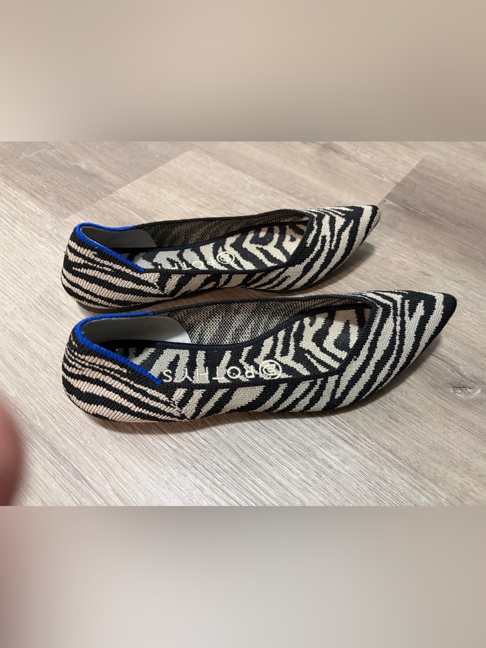 Rothy’s zebra print W8 flats